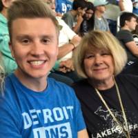 Four people watching the football game